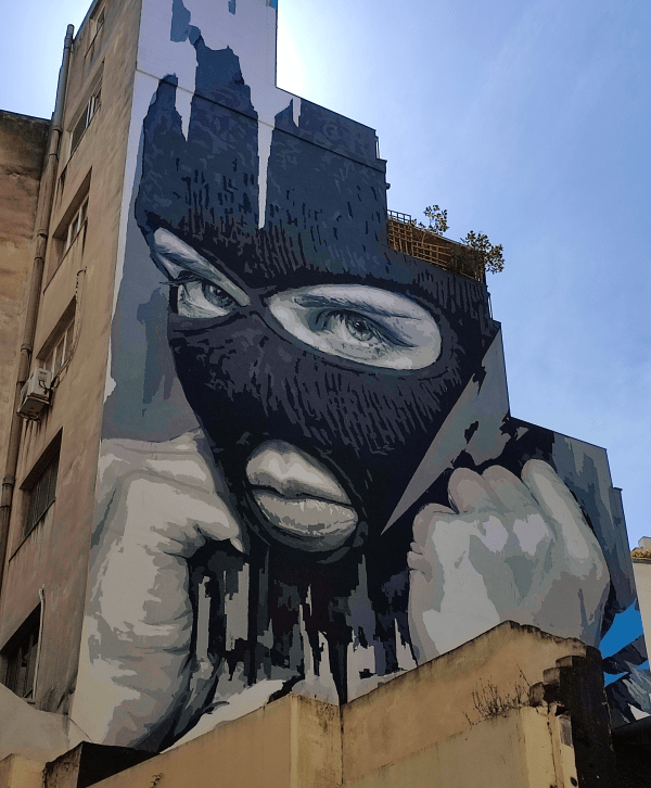 Street Art in Athens. Graffiti of a full-faced woman.